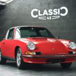 Exterior of a 1973 Red Bahia Porsche 911 2.4E Targa fully restored in 2019 with 12.685 km and black leather interior