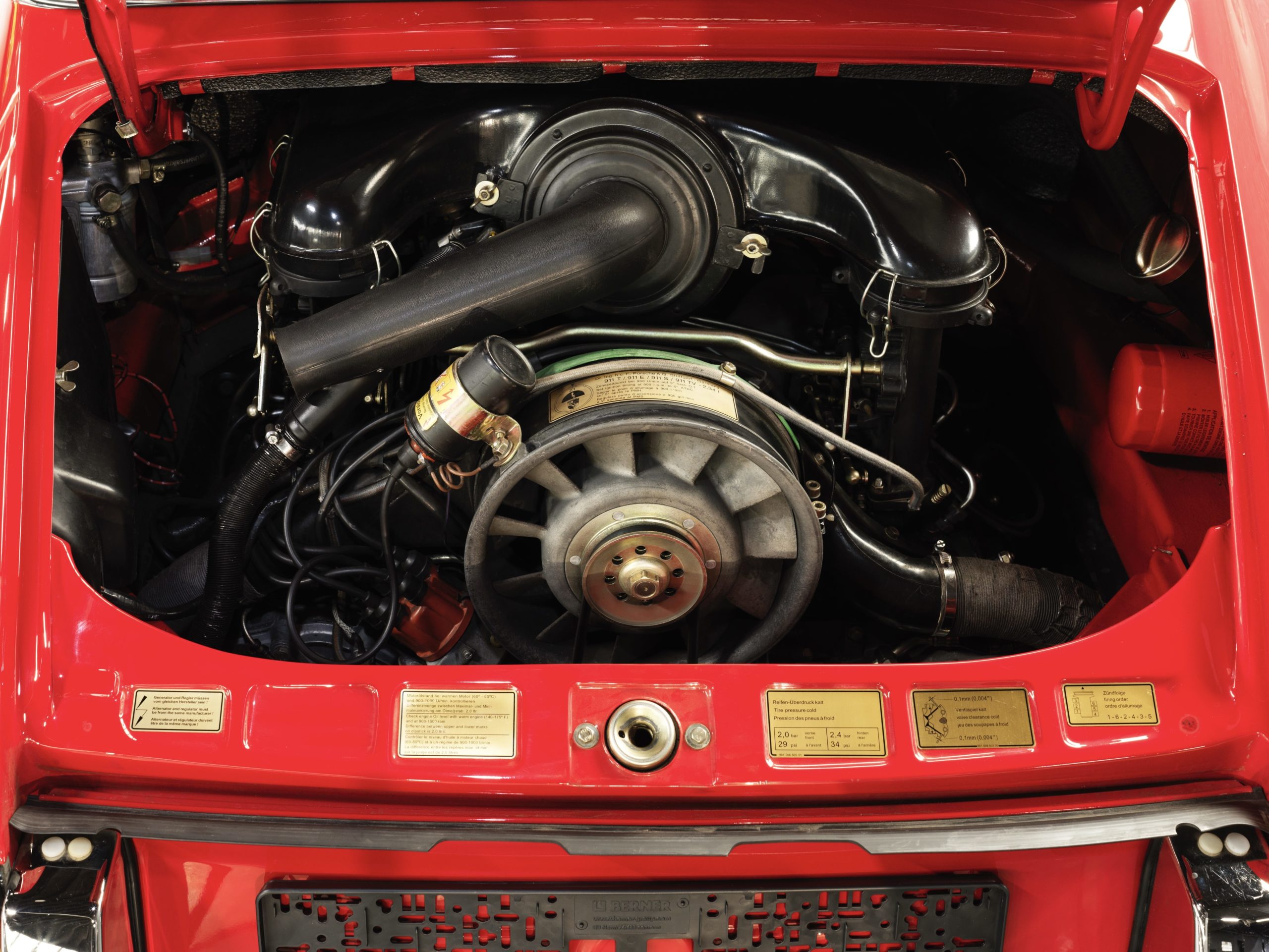 engine of a 1973 Red Bahia Porsche 911 2.4E Targa fully restored in 2019 with 12.685 km and black leather interior