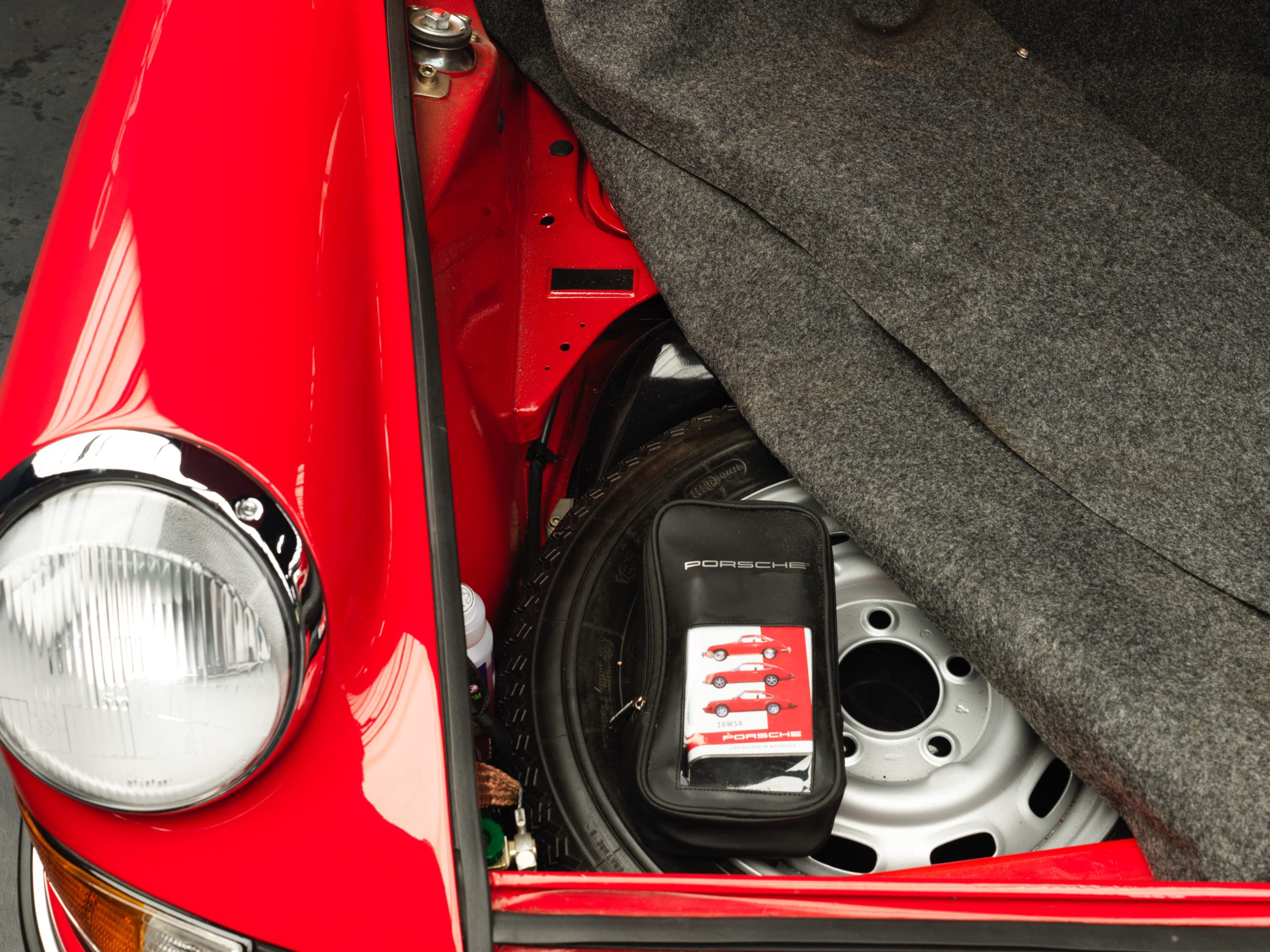front boot of a 1973 Red Bahia Porsche 911 2.4E Targa fully restored in 2019 with 12.685 km and black leather interior